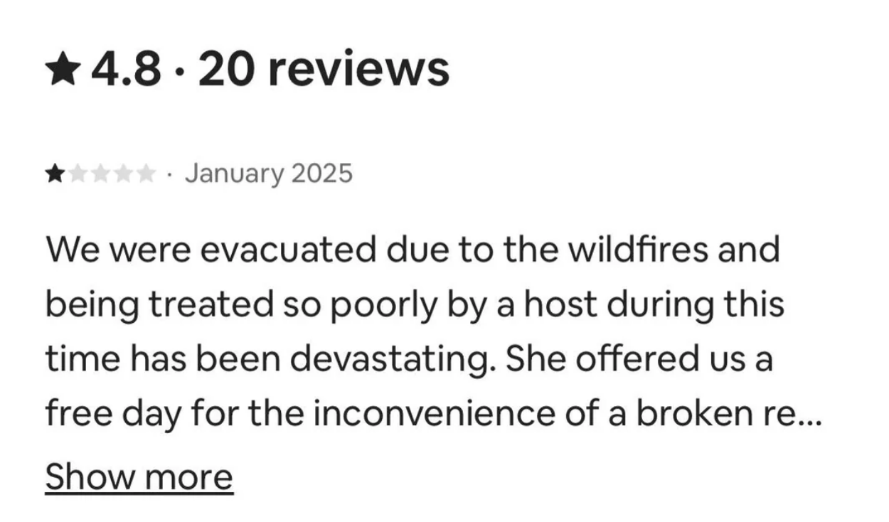 Part of a review mentioning evacuation due to wildfires, poor host treatment, and a free day offered for a broken issue
