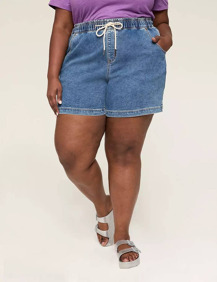 Social media trends Viral content Trending hashtags Social media updates Trending memes and videos Person modeling casual denim shorts with a drawstring waist and comfortable sandals