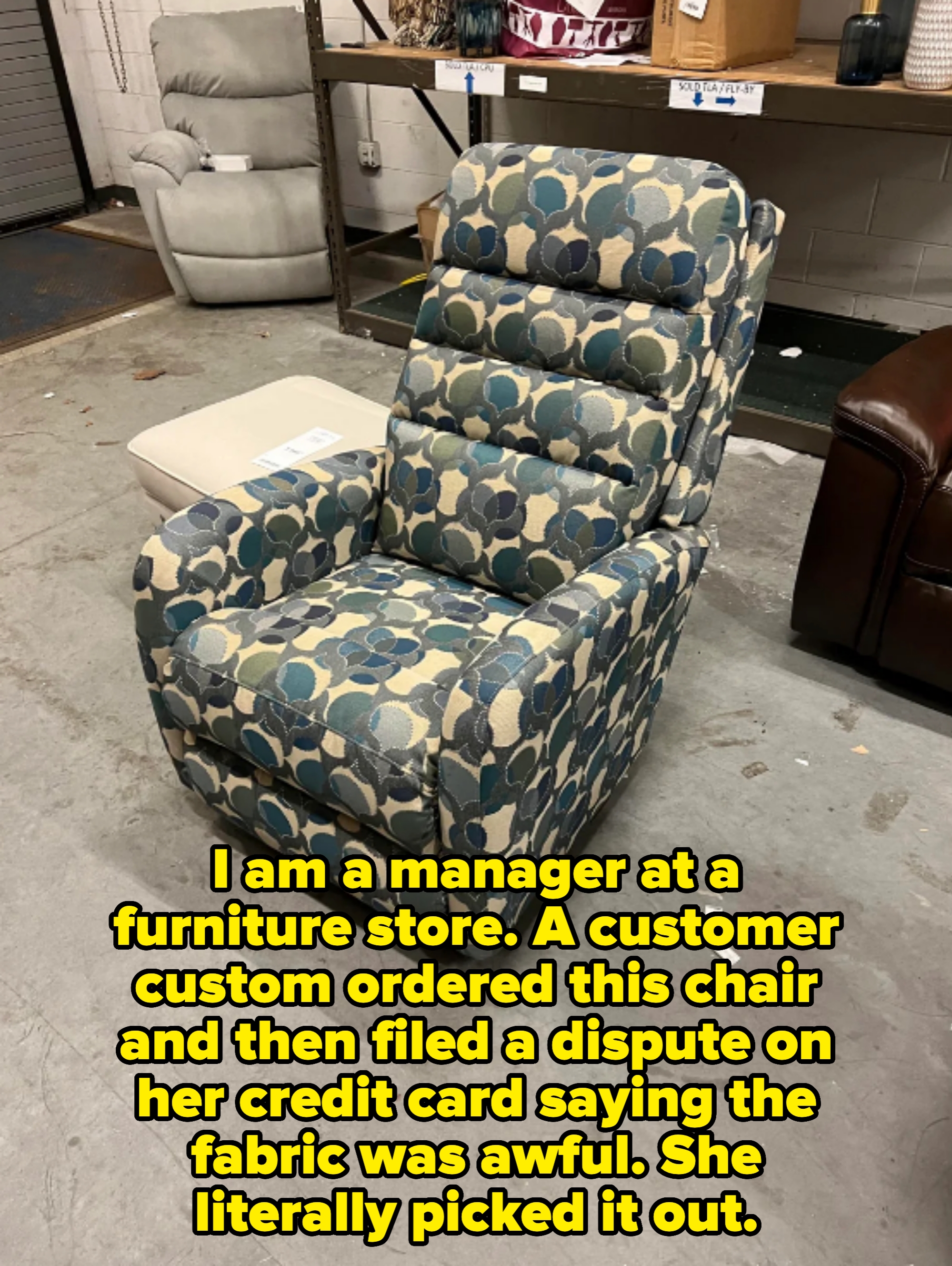 Patterned recliner chair in a store showroom, surrounded by other furniture pieces