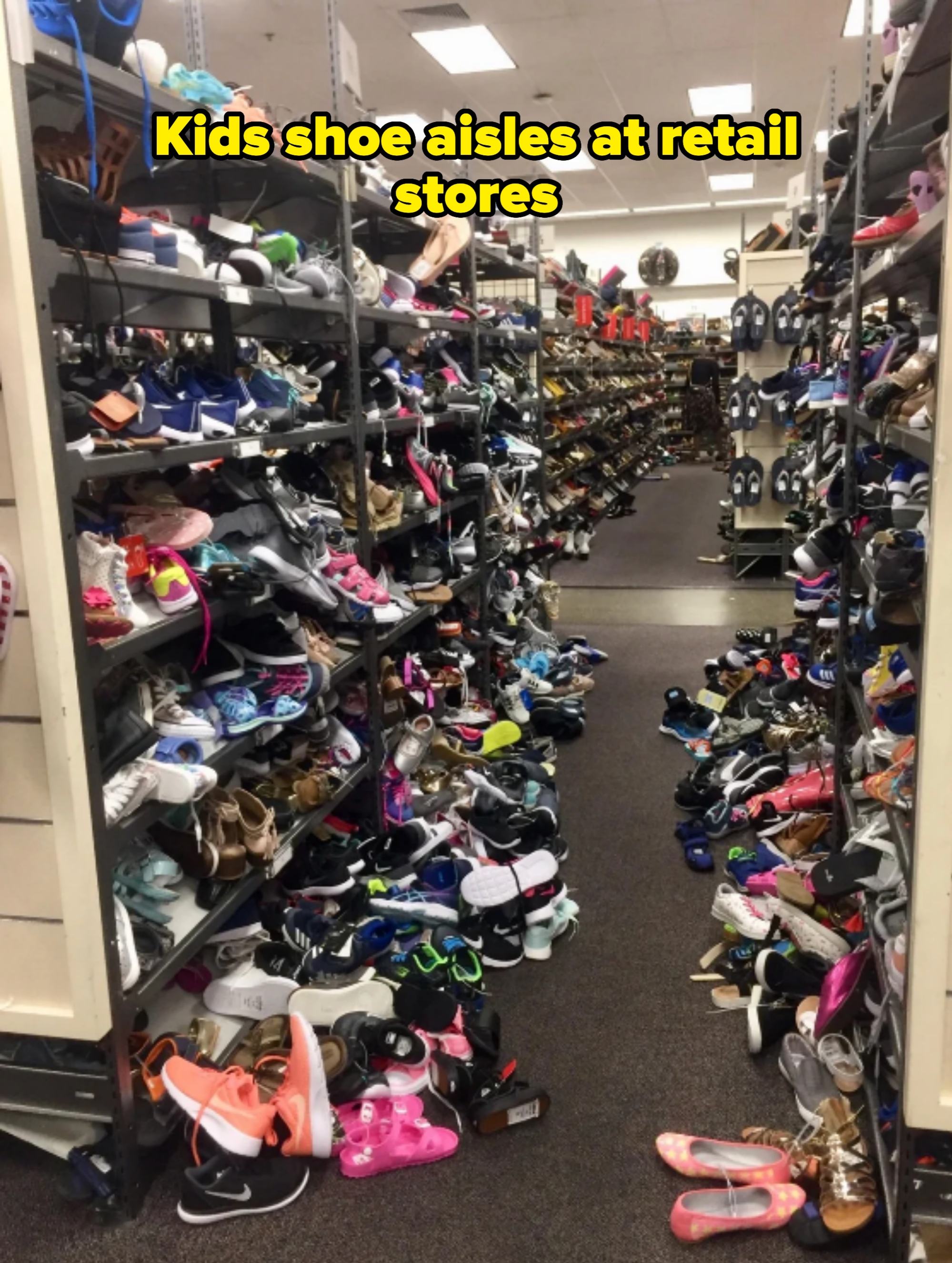 Shoe store aisle with shelves cluttered with various types of shoes scattered on the floor