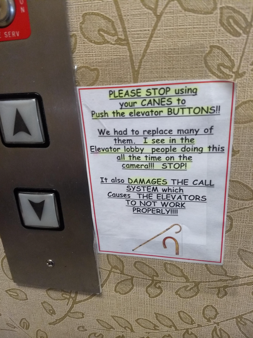 Note on elevator: "Please stop using canes to push buttons. It damages the system, causing elevators to malfunction."