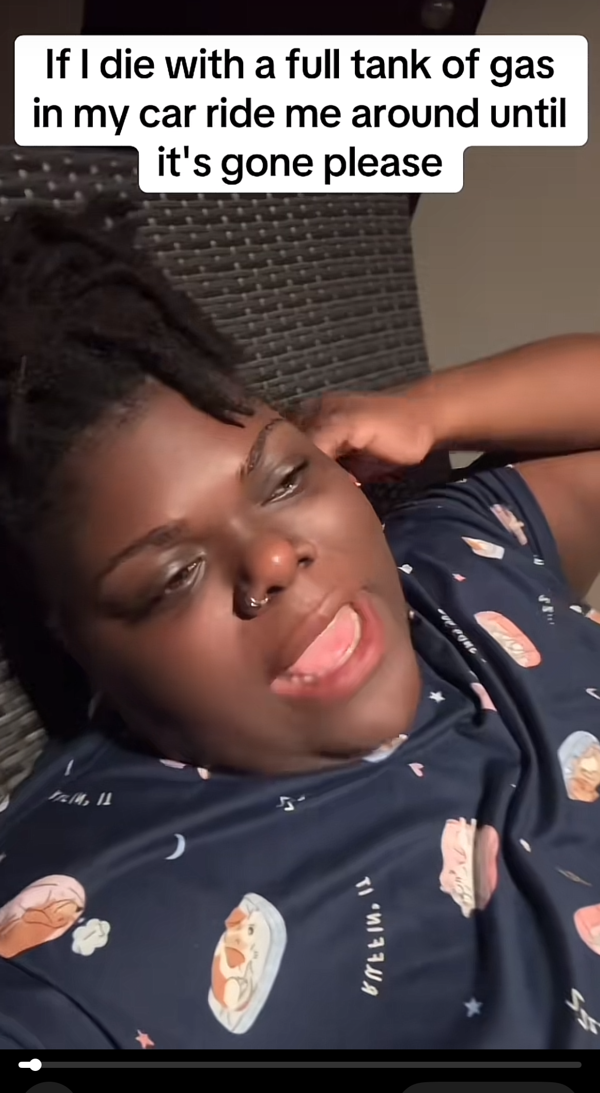 Person reclines in video. Text above: &quot;If I die with a full tank of gas, ride me around until it's gone, please&quot;