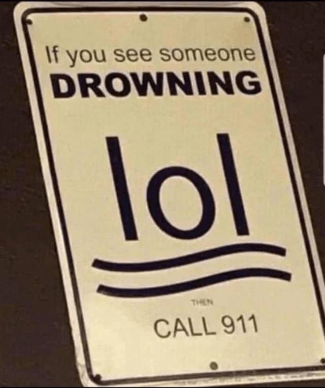 Sign humorously says: "If you see someone drowning lol then CALL 911," with "lol" stylized as water waves