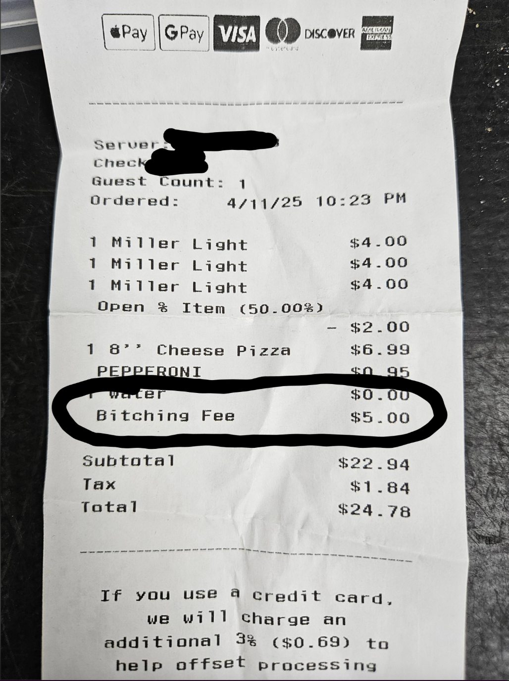 Receipt showing a "Bitching Fee" of $5 added to pizza and drinks order, totaling $22.94. Card payment incurs a 3% fee