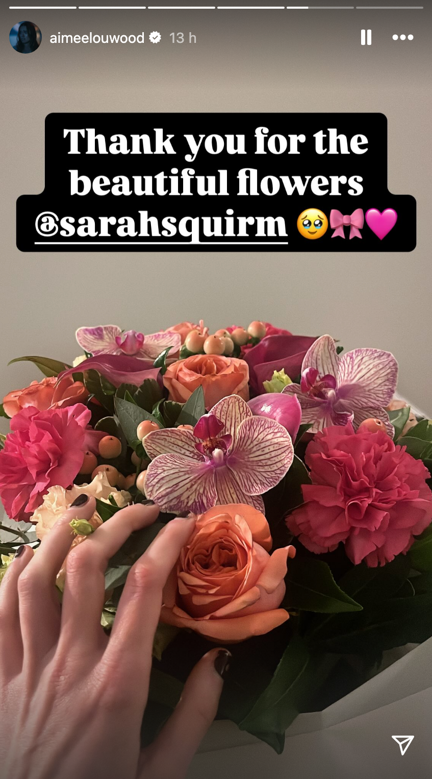 Screenshot from Aimee Lou Wood's Instagram story showing a bouquet of mixed flowers with a message thanking @sarahsquirm
