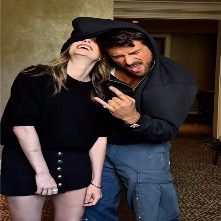Brandon playfully putting Meghann in a headlock behind the scenes