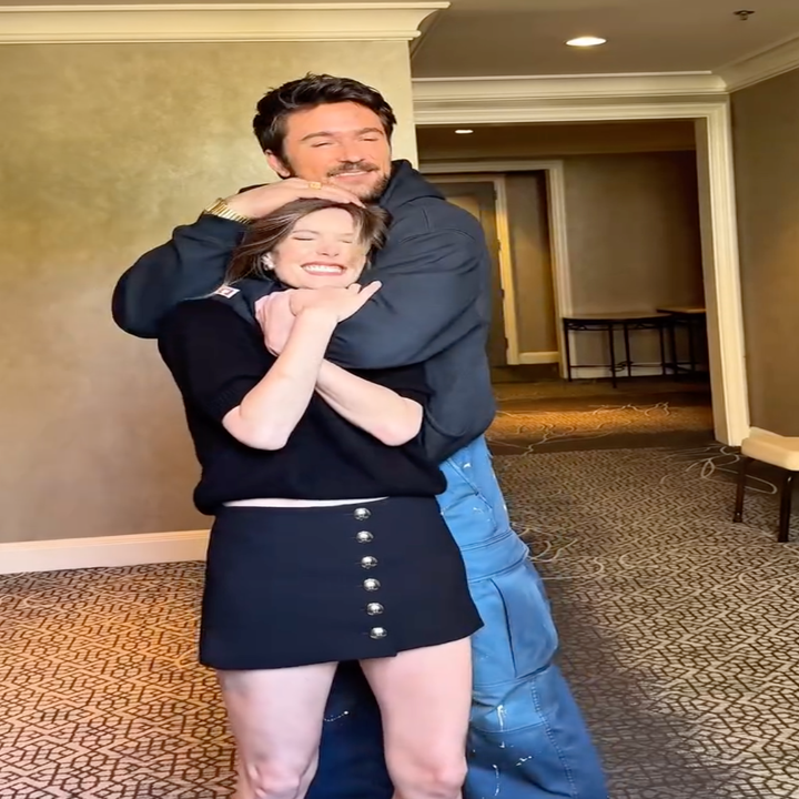 Meghann and Brandon hugging and laughing behind the scenes