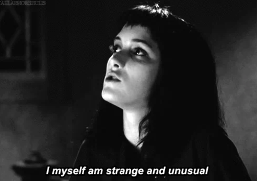 Person looking up with a thoughtful expression. Caption at bottom reads, "I myself am strange and unusual."