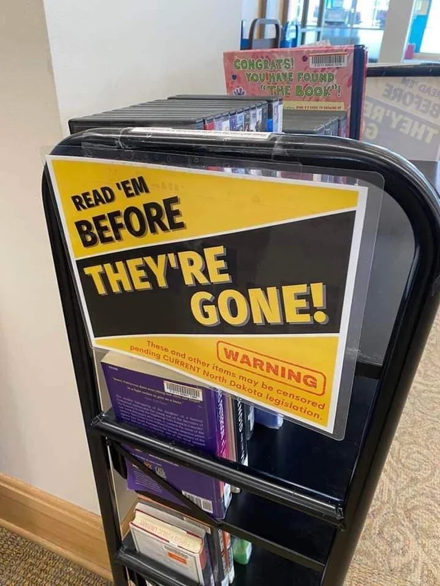 Library sign warning of potential book censorship due to pending North Dakota legislation