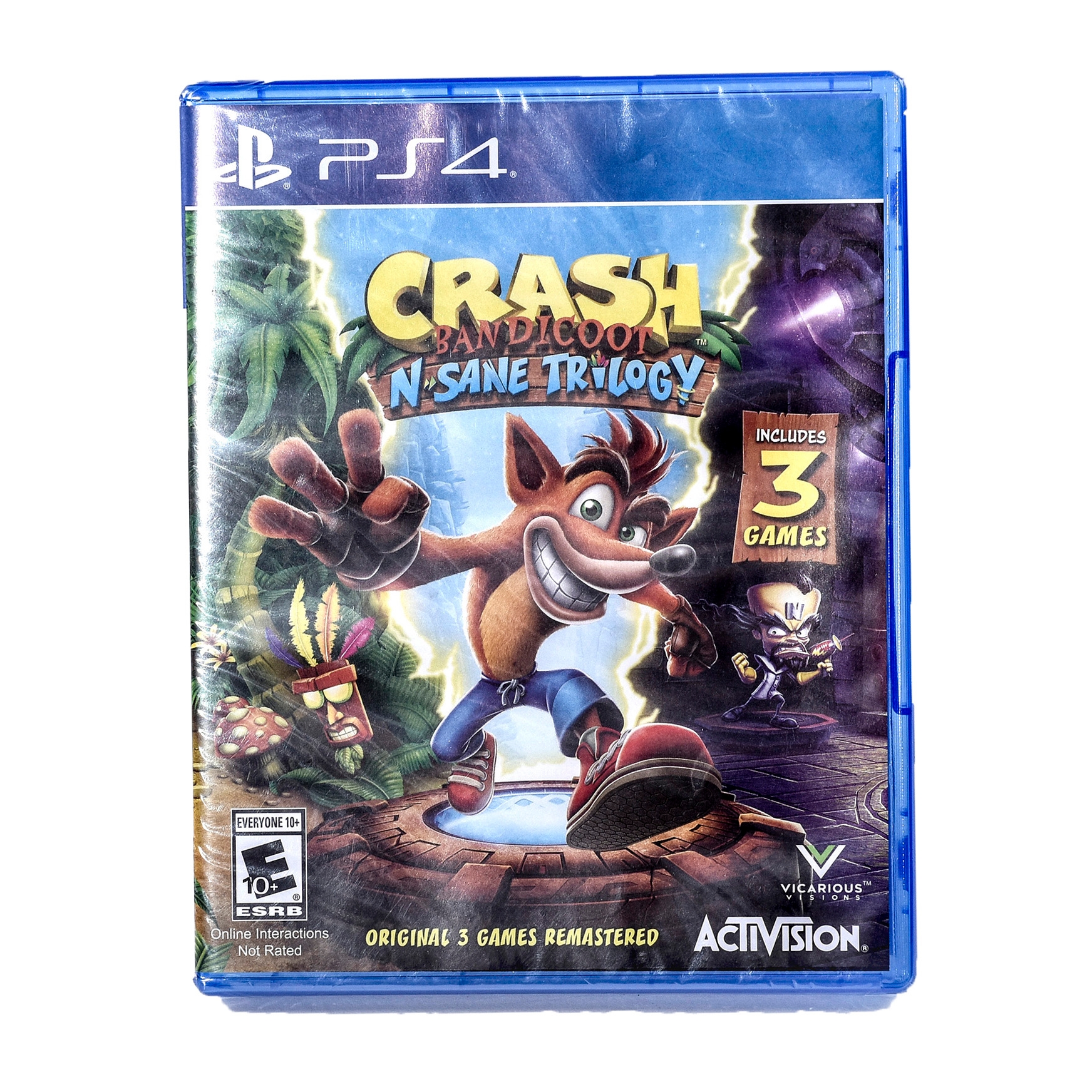Crash Bandicoot N. Sane Trilogy PS4 game case showing Crash with Cortex and Uka Uka; includes 3 remastered games