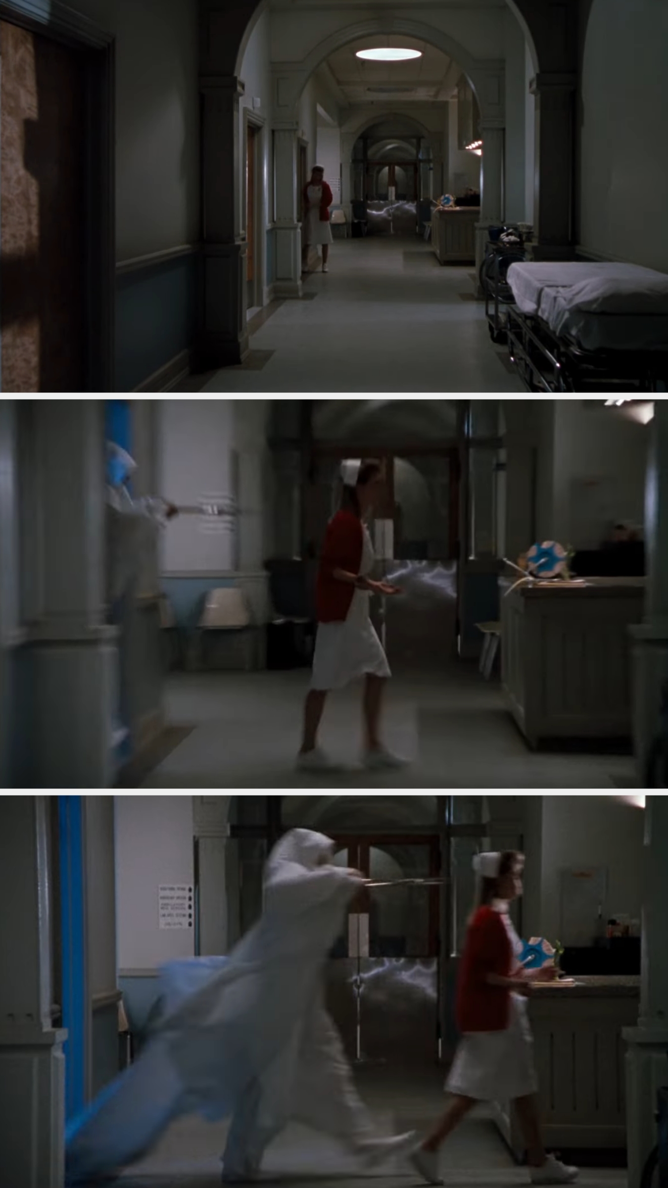 Hospital scene from a film, with a person in a gown and cap chasing another person in a hallway