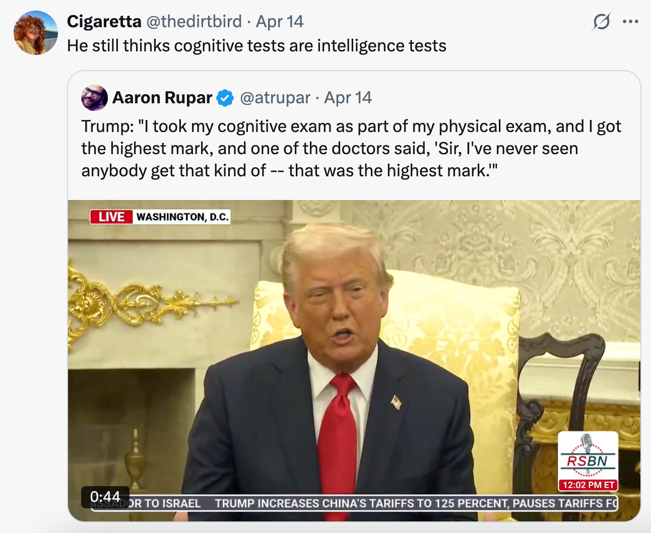 A man speaking in a formal setting, with a tweet mentioning a cognitive exam result above. Text says the speaker got the highest mark on the exam