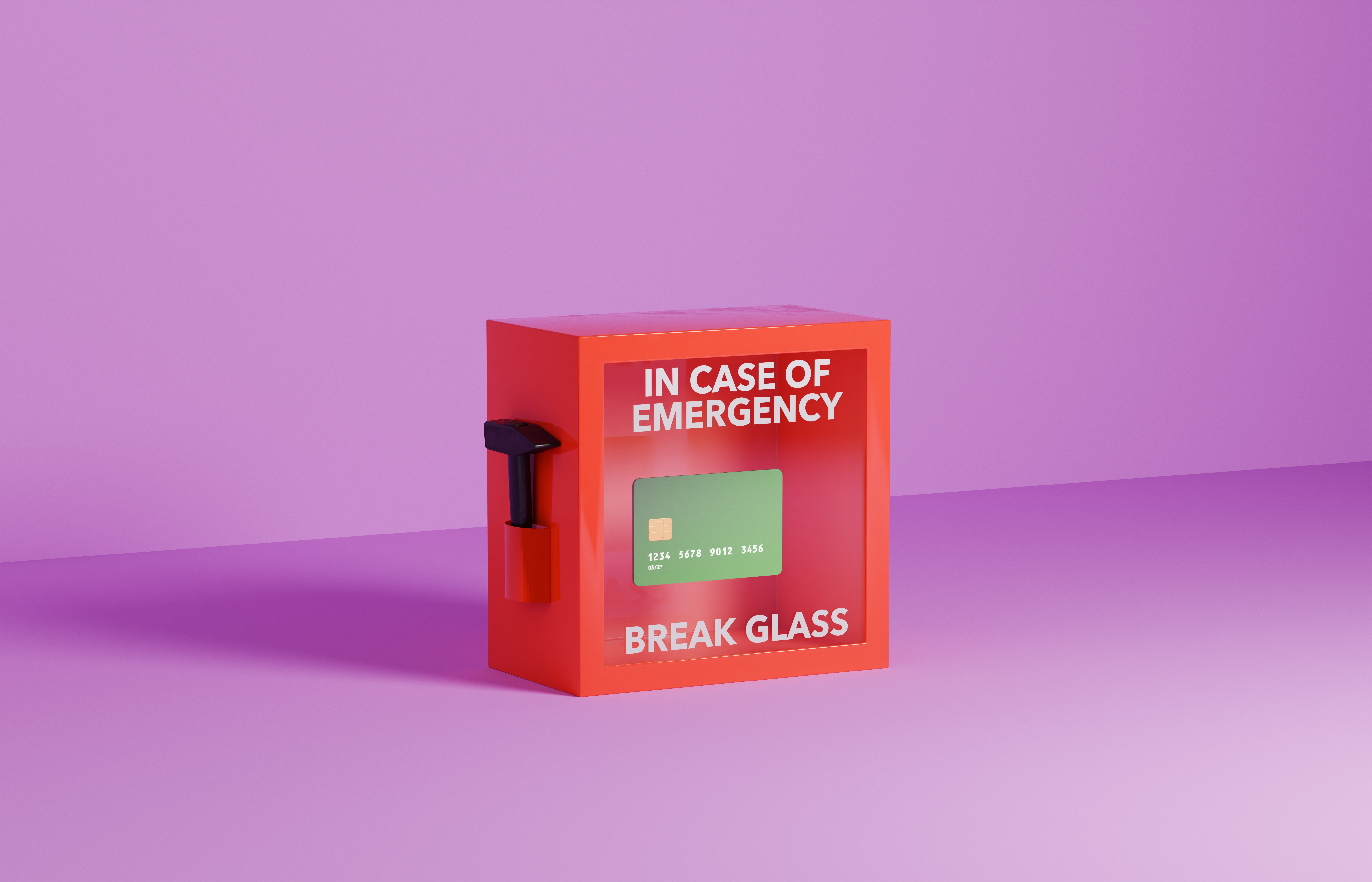 Red box with text "In Case of Emergency Break Glass," showing a credit card inside, against a plain background
