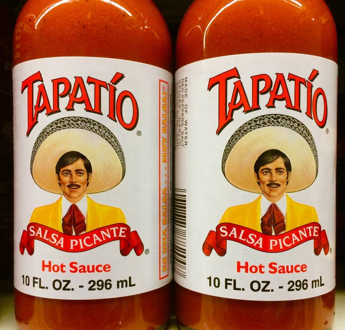 Two bottles of Tapatío hot sauce with a label featuring a man in a sombrero and a yellow jacket. Each bottle contains 10 fl. oz. (296 mL)