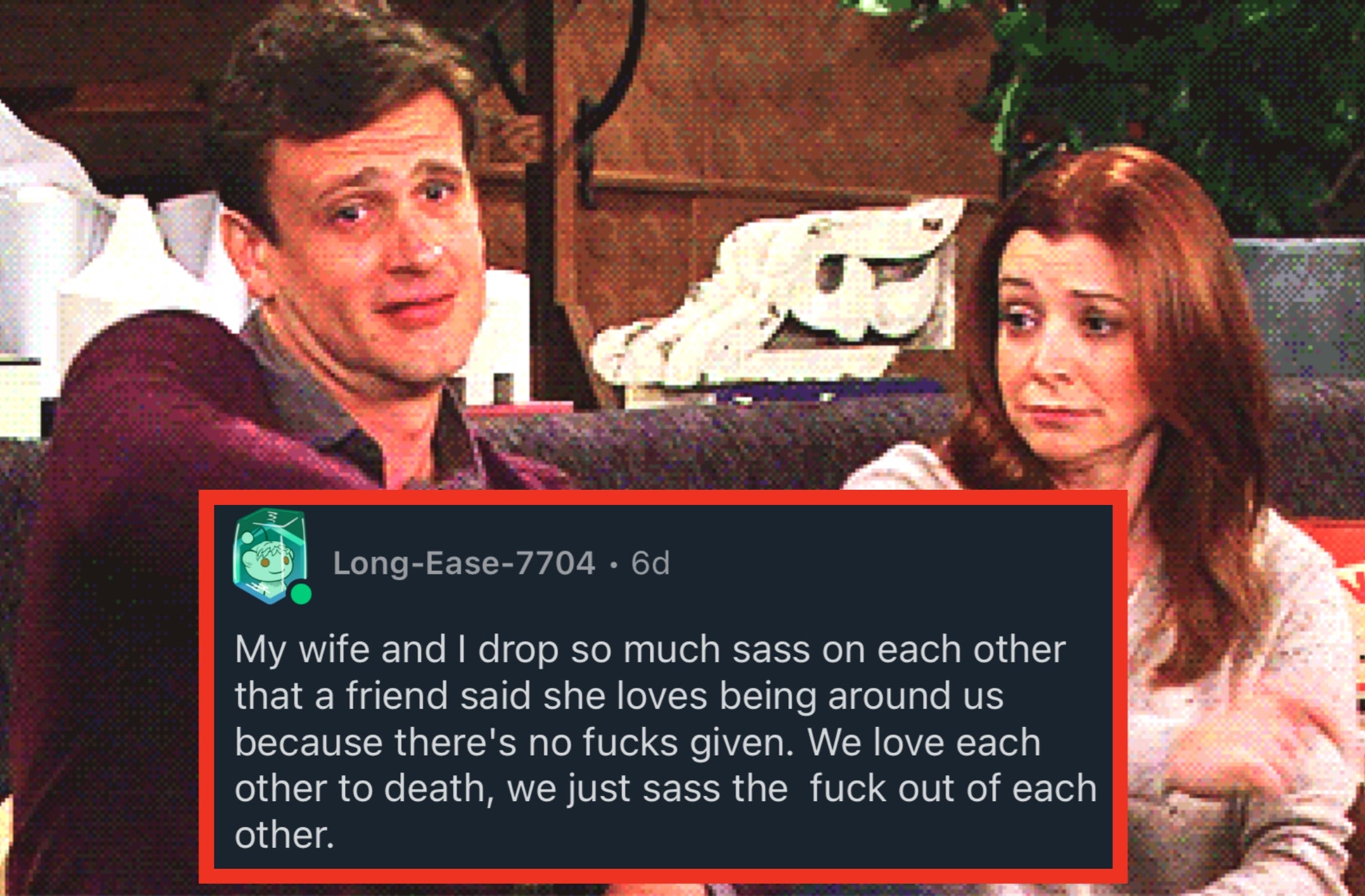 Two people sitting on a couch, each giving a thumbs up with an amused expression