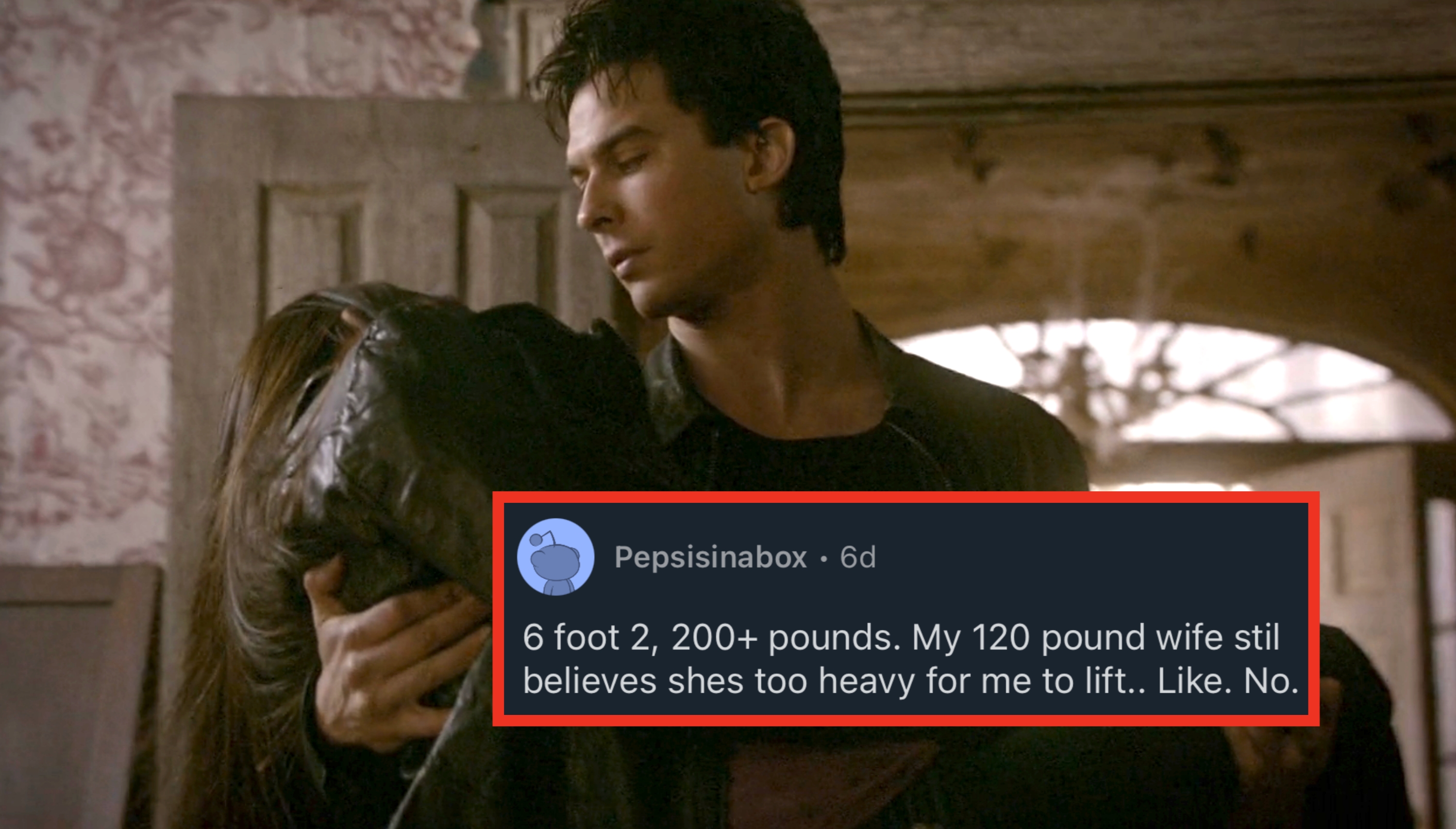 A man in a dark jacket carries a woman in a hallway, looking down at her with concern