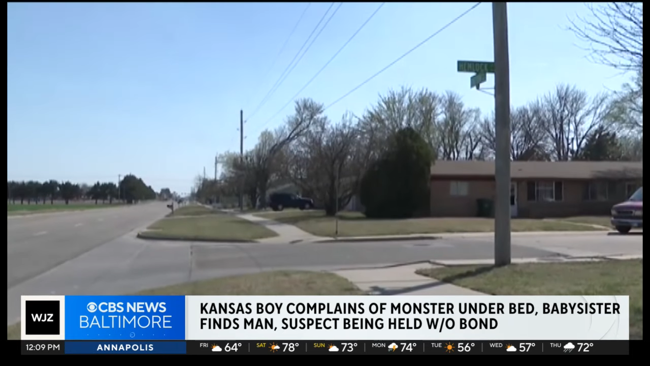 A suburban street is shown. The news headline reports a Kansas boy complained of a monster under his bed, and a man was found; the suspect is held without bond