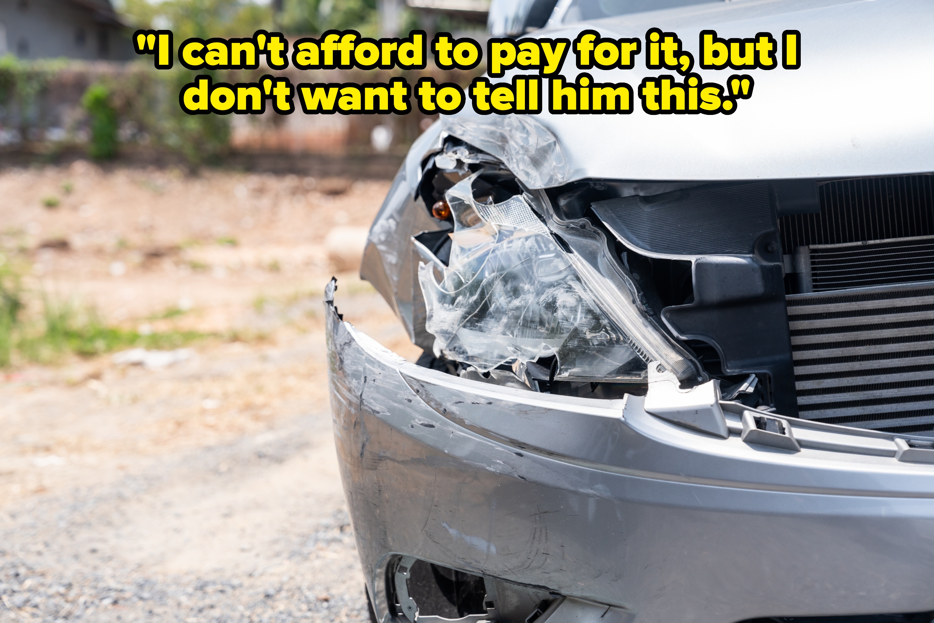 Close-up of a car's front end, showing visible damage to the headlight and bumper