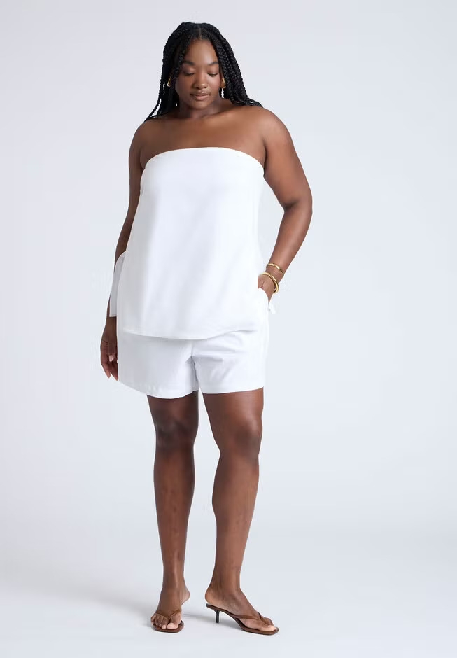 Model wearing the white shorts