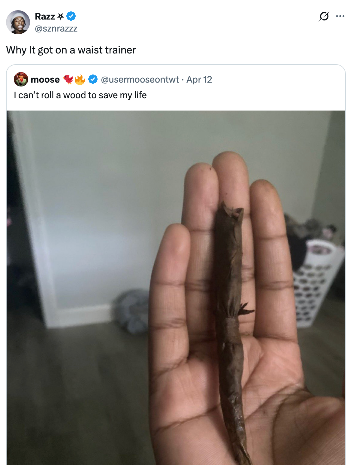 A hand holds a poorly rolled cigar-like item with a tweet commenting humorously about the rolling skills