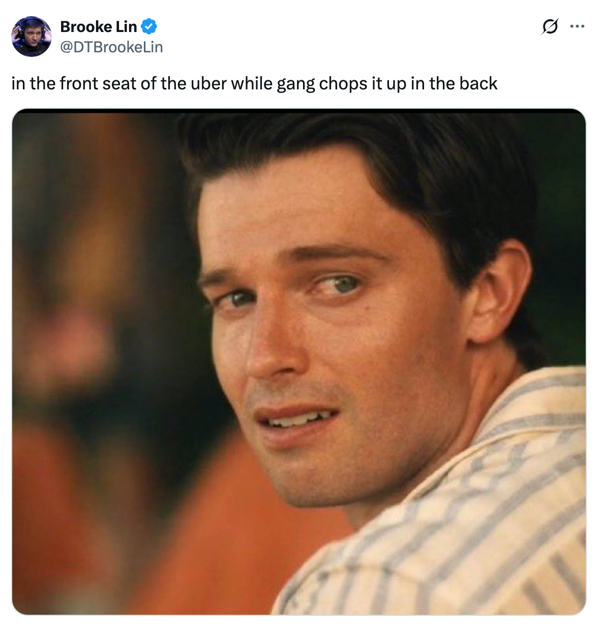 A person with a concerned expression, sitting in a vehicle's front seat. Caption: "in the front seat of the uber while gang chops it up in the back."