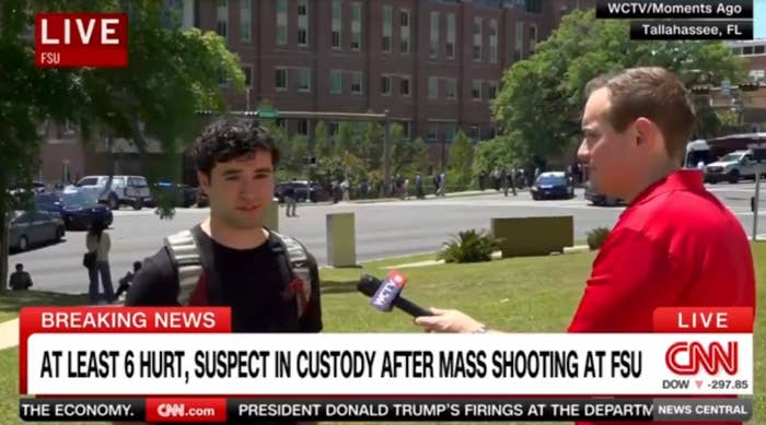 Reporter interviews a student on campus about a mass shooting at FSU; headline states 6 hurt, suspect in custody