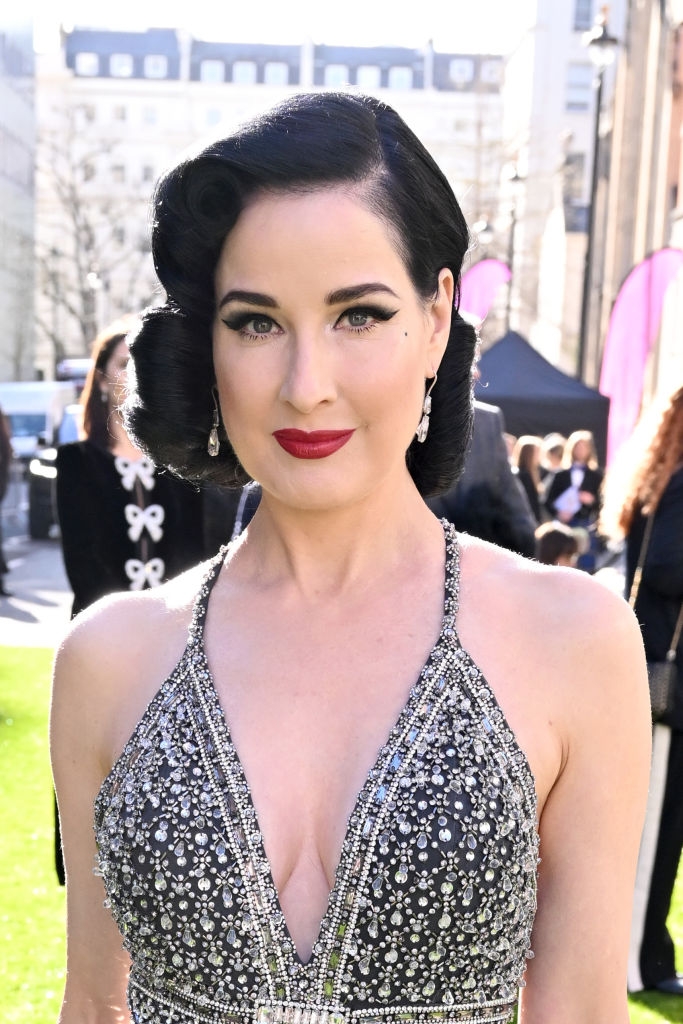 Dita with winged liner and a bold lip