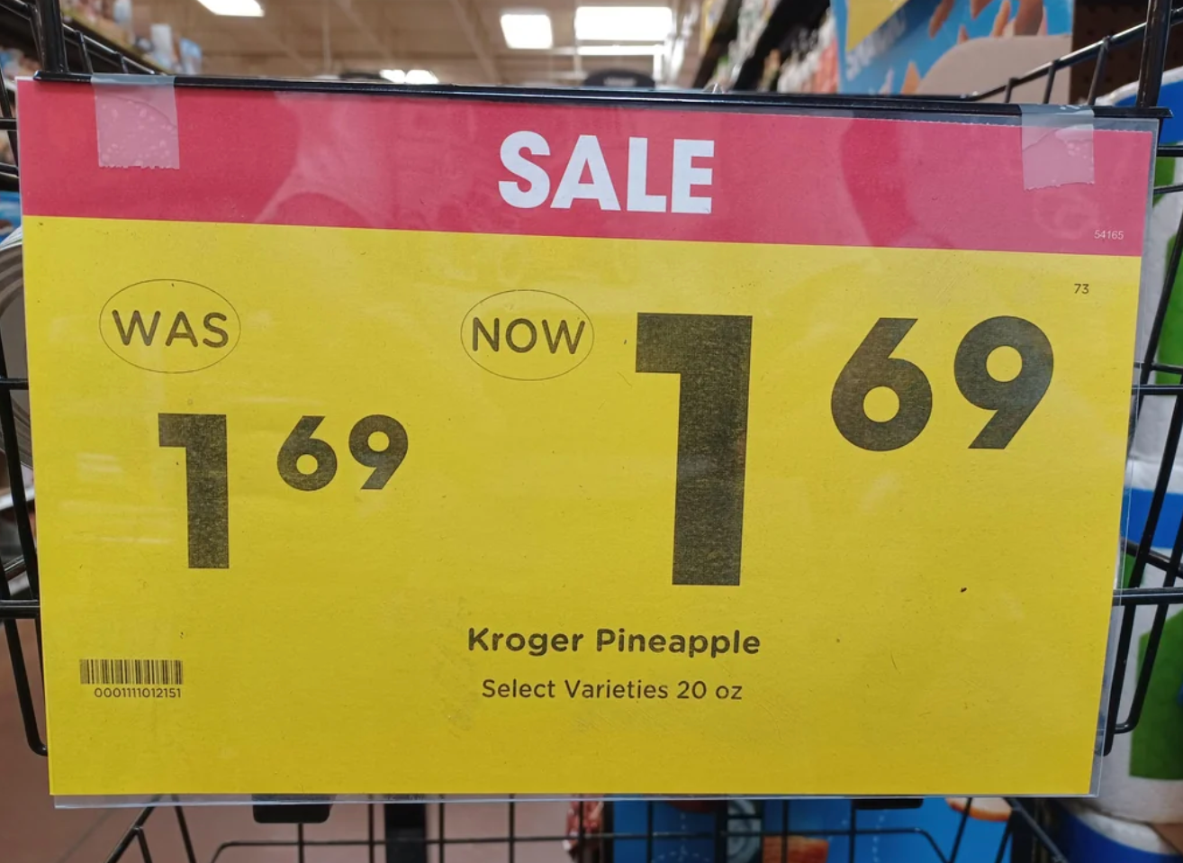 Sale sign for Kroger Pineapple, 20 oz. Price reduced from $1.69 to $1.69