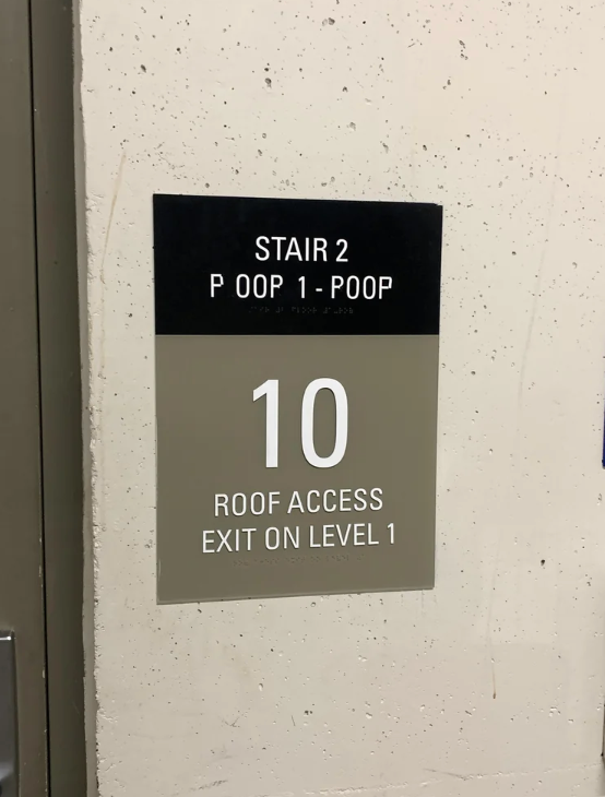 Sign showing "Stair 2," unexpected line break in "Poop 1-Poop," floor "10," and directions for roof access and exit on level 1
