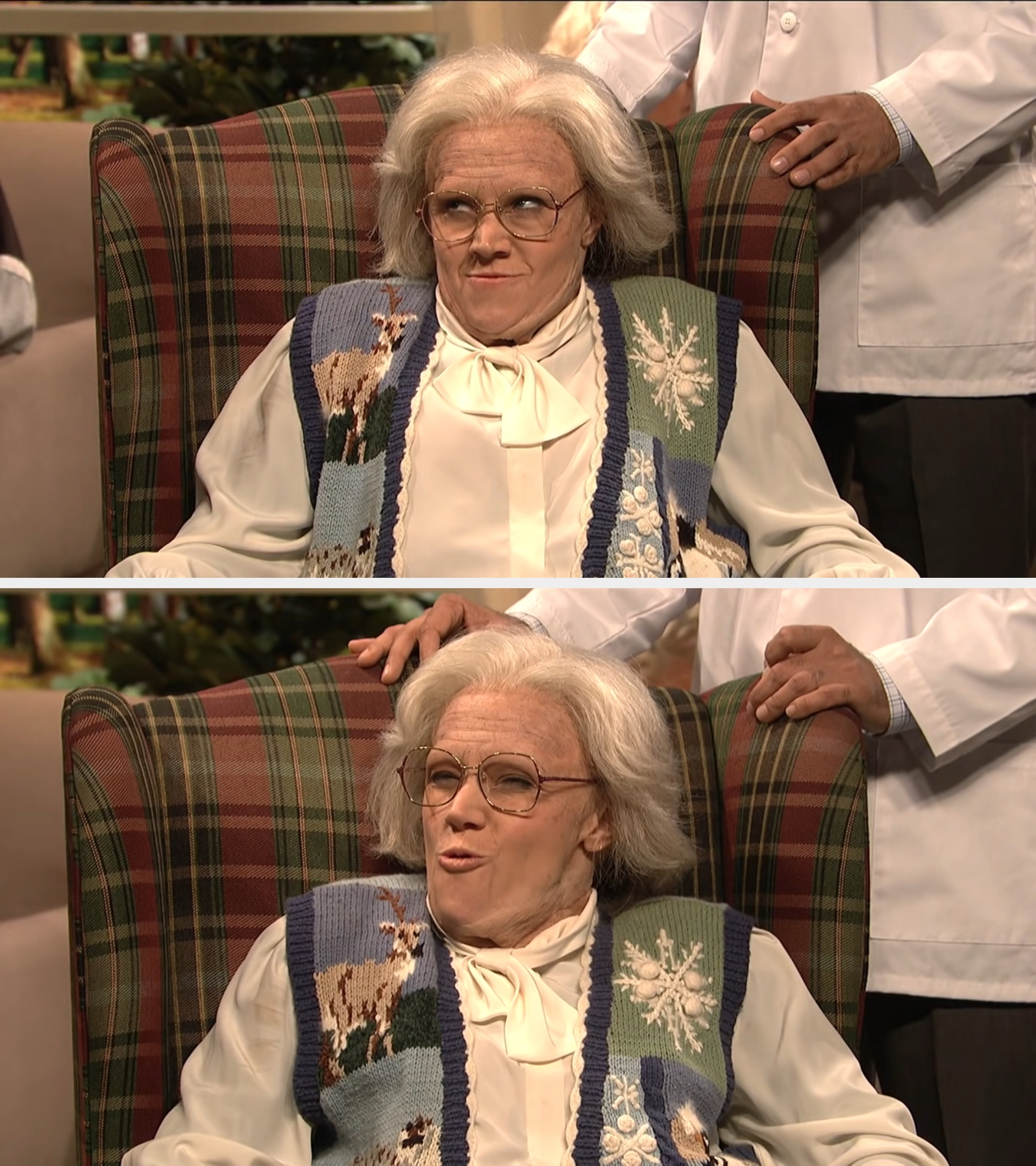 Elderly woman with glasses and a blue knitted vest featuring a sheep and snowflake design, seated with a skeptical expression