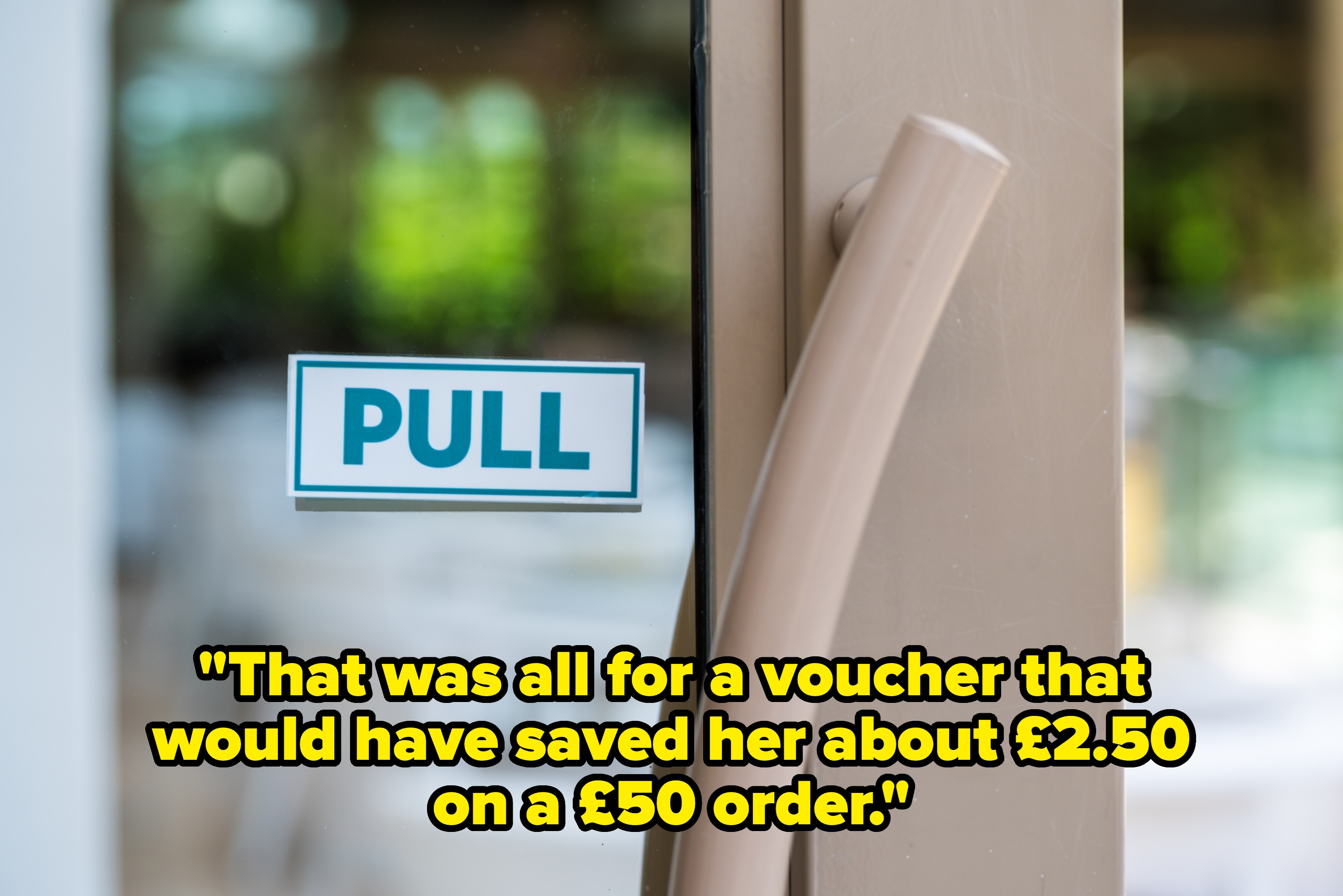 Door with a "PULL" sign and a curved handle, suggesting the action required to open it