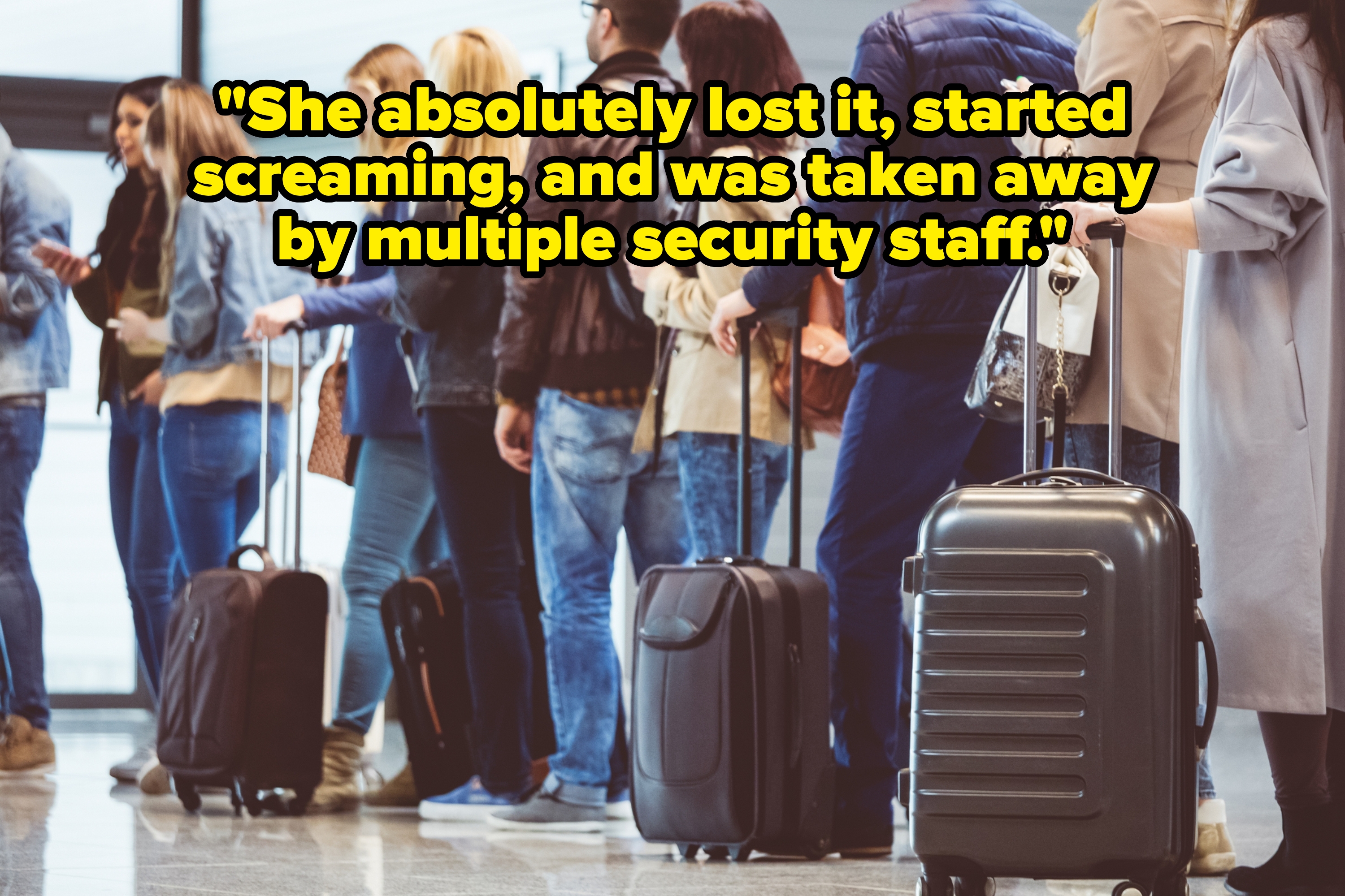 People standing in a line at an airport with luggage, showing a typical travel scene