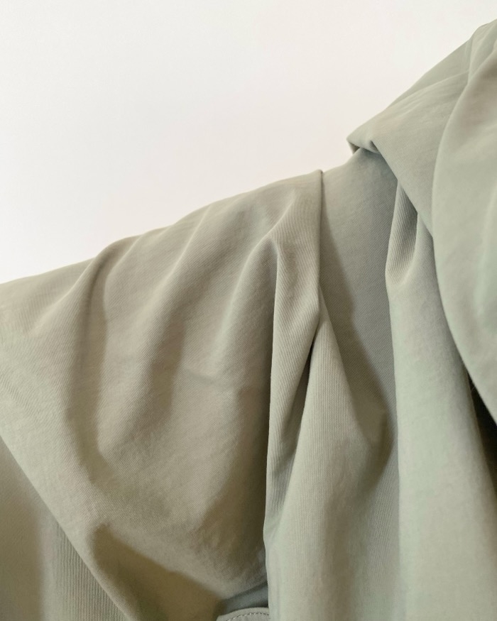 Close-up of draped fabric with soft folds and textures