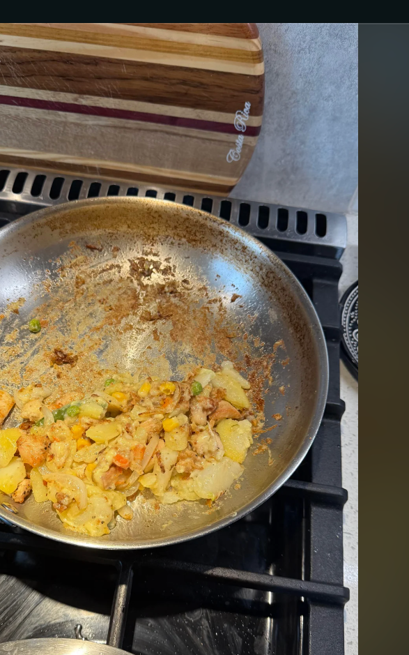 A pan on a stove with vegetables being cooked, seen within a Reddit post discussing cooking tips