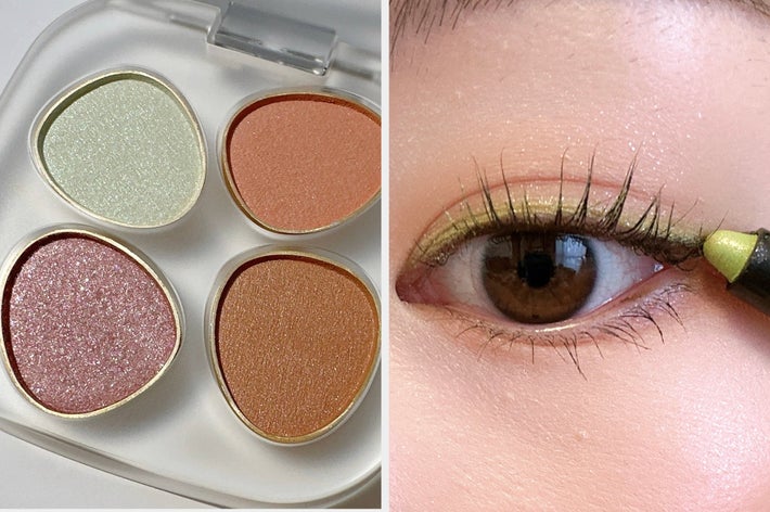 アイシャドウパレットとブラシのクローズアップ。ブラシが薄い色のアイシャドウに接触しています。