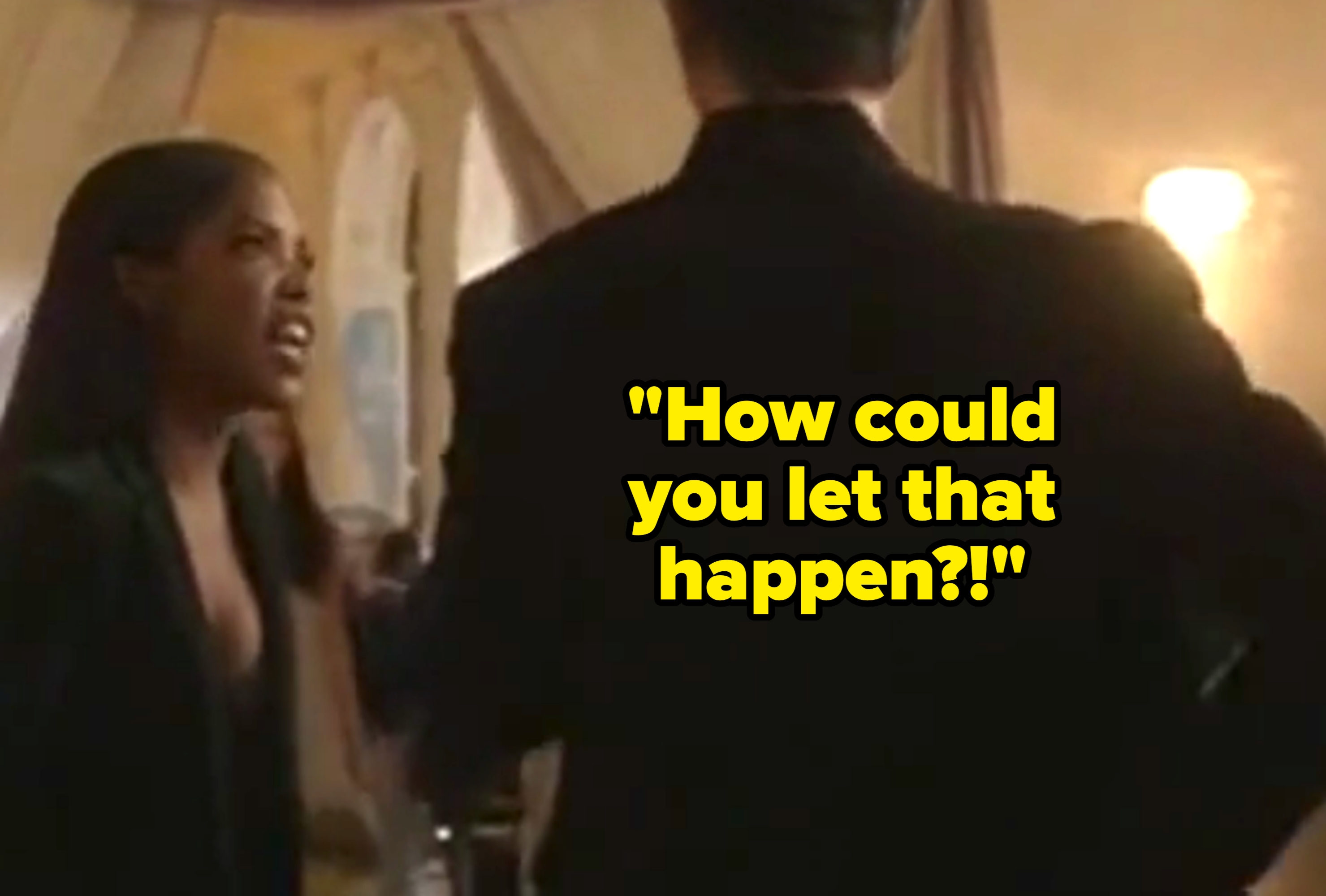 A woman in formal attire argues passionately with a person in a suit inside an elegant room