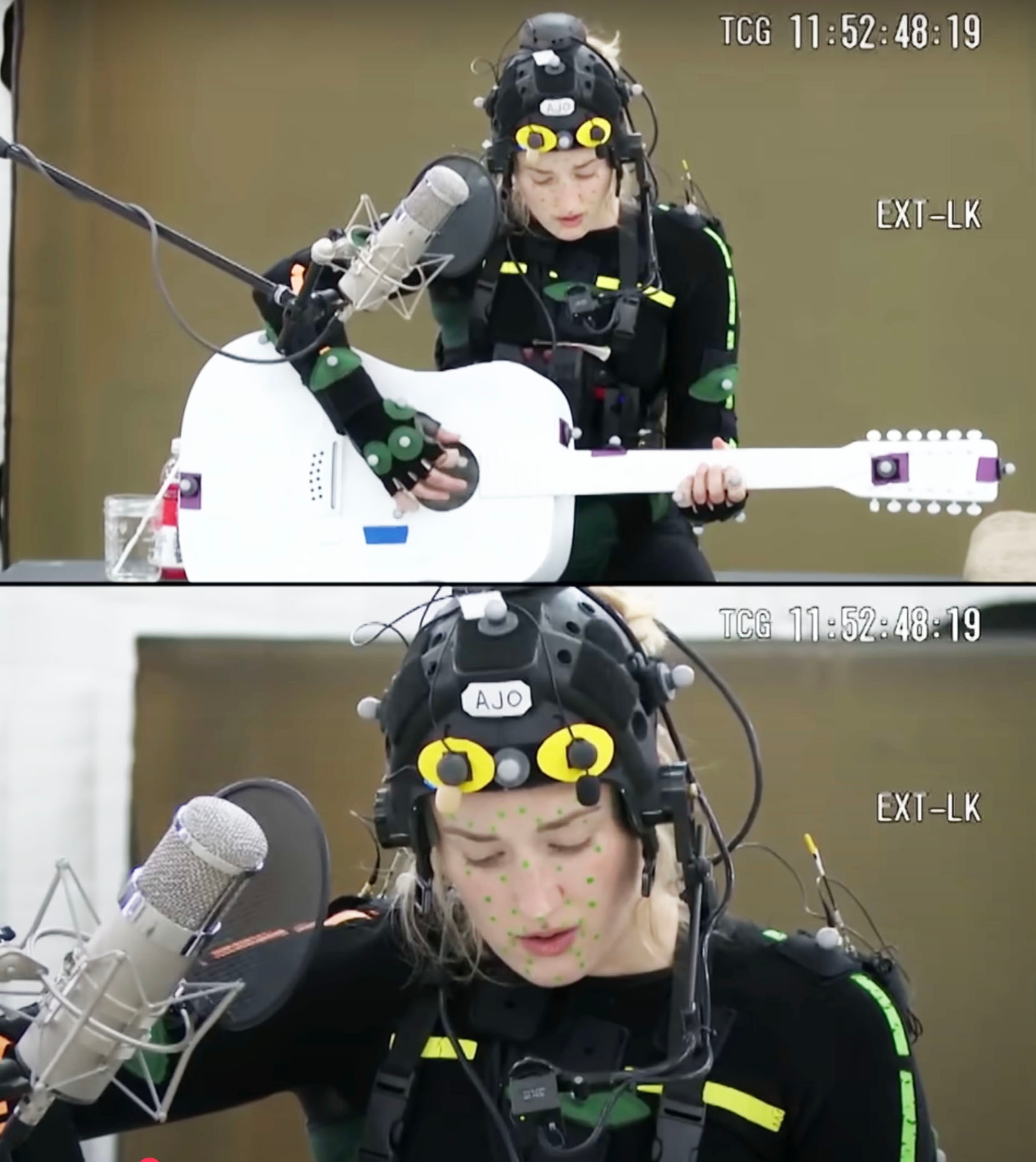 Ashley in motion capture gear plays a guitar and sings into a microphone