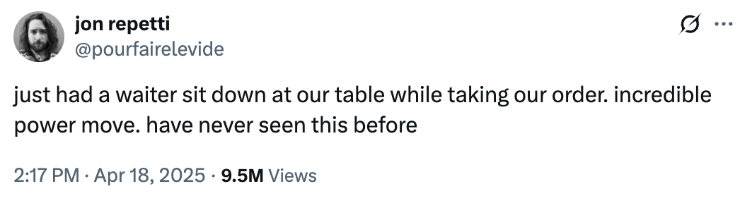 Tweet by Jon Repetti: A waiter sits while taking the order, calling it an incredible power move and something never seen before