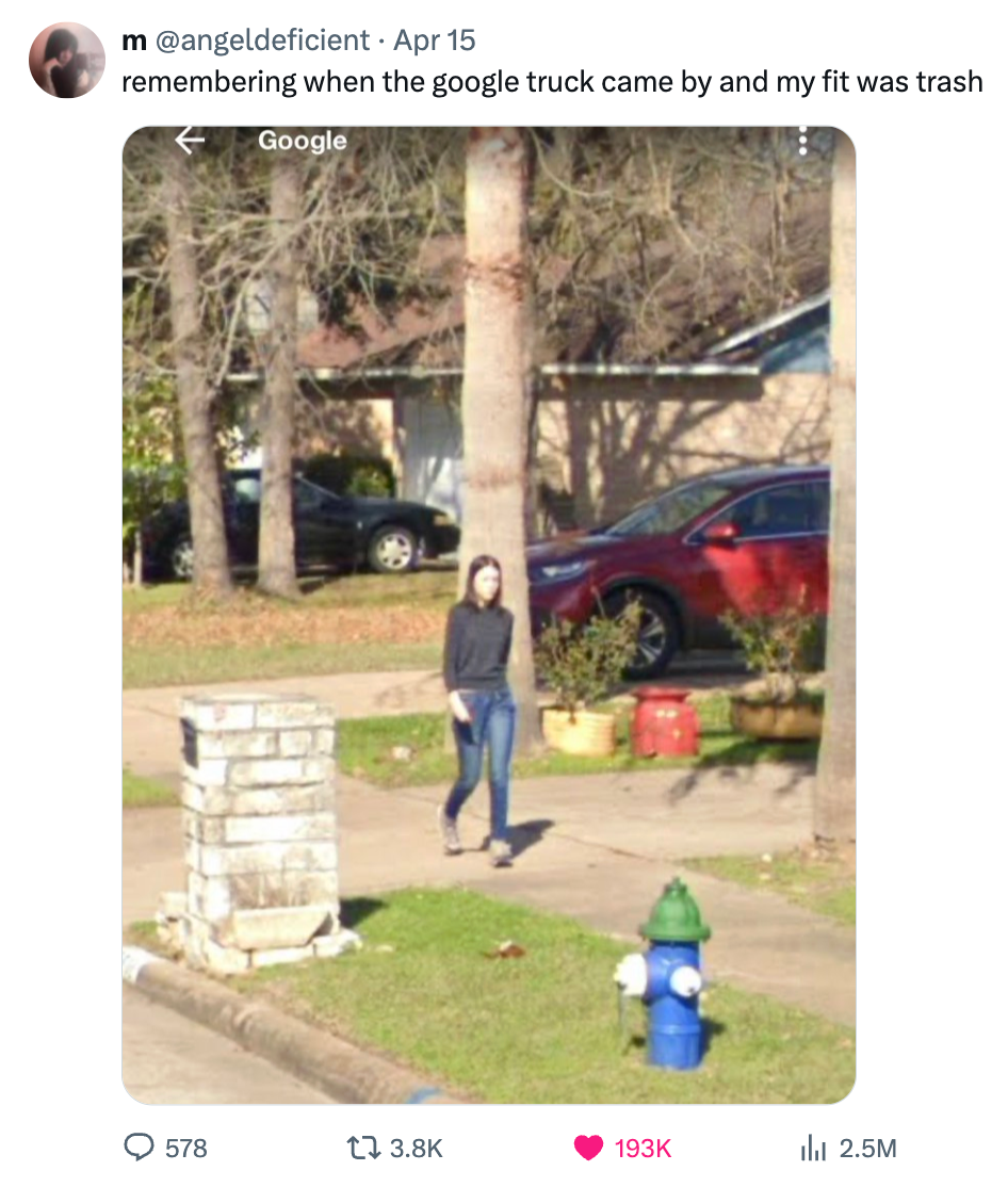 A person stands on a residential street near a hydrant, humorously captioned about a "trash" outfit as captured by a Google truck