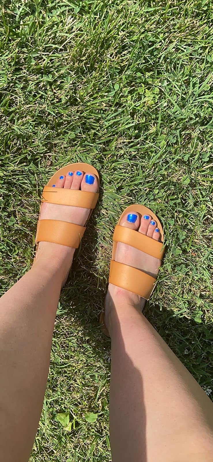 reviewer wearing tan sandals
