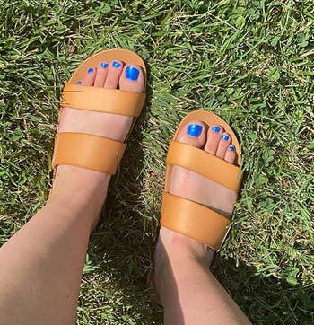 reviewer wearing tan sandals