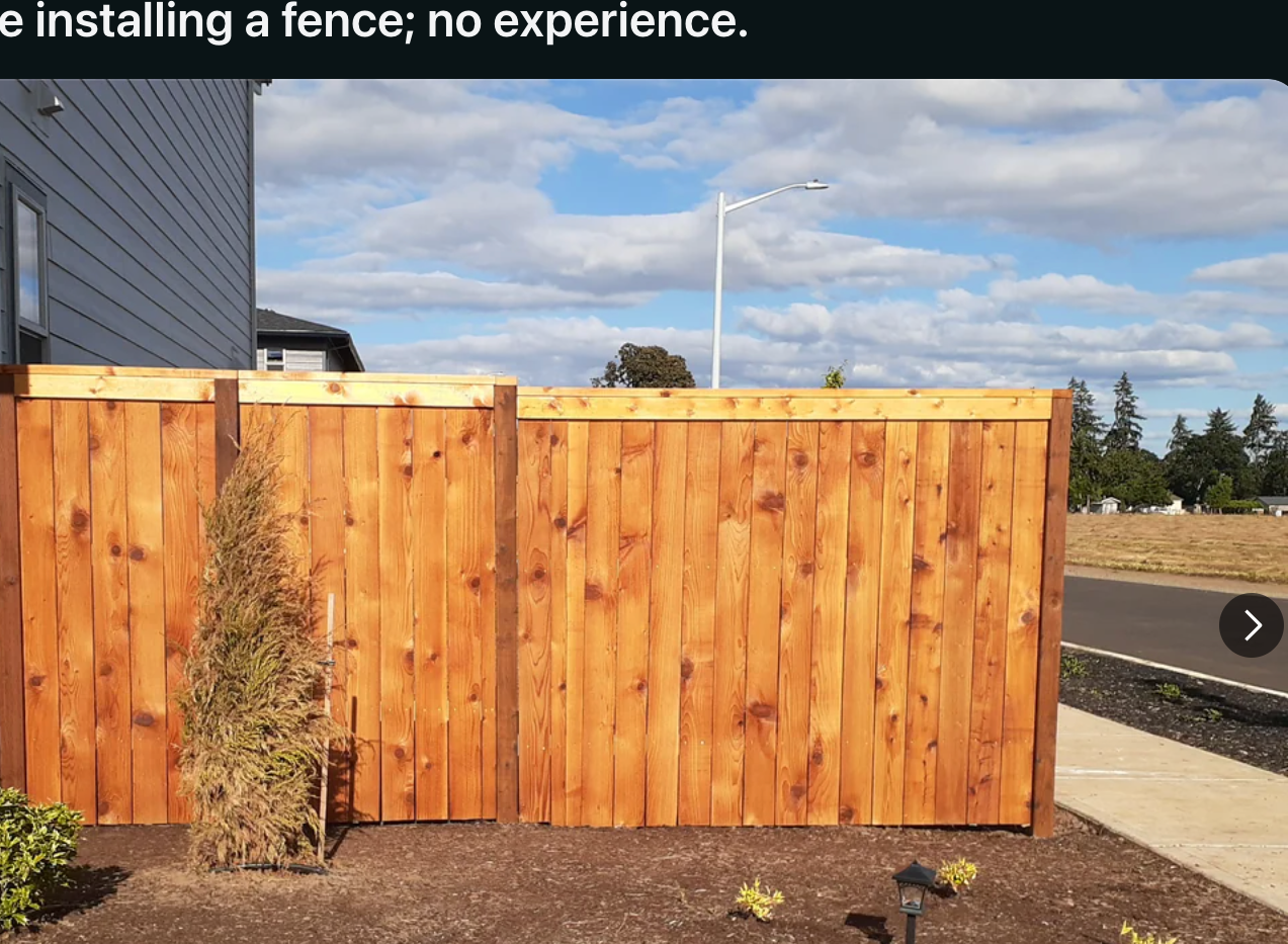 Reddit post showing a wooden fence installation by a user with no prior experience. The fence is neatly placed beside a house