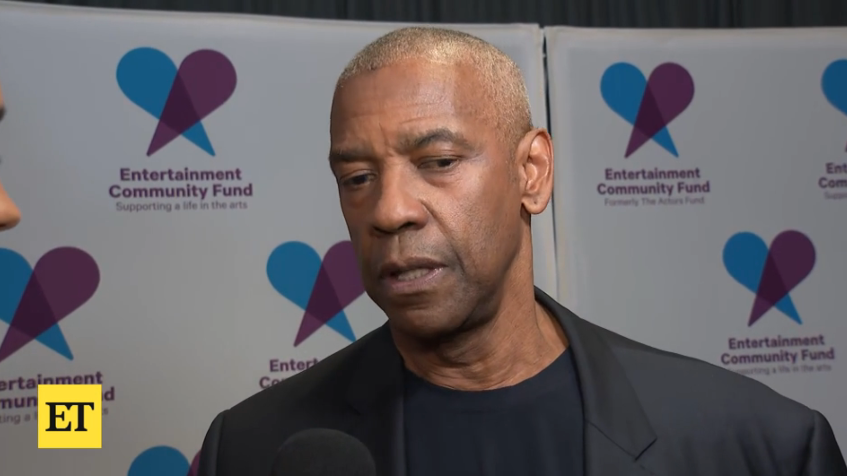 Denzel Washington during a red carpet interview with ET