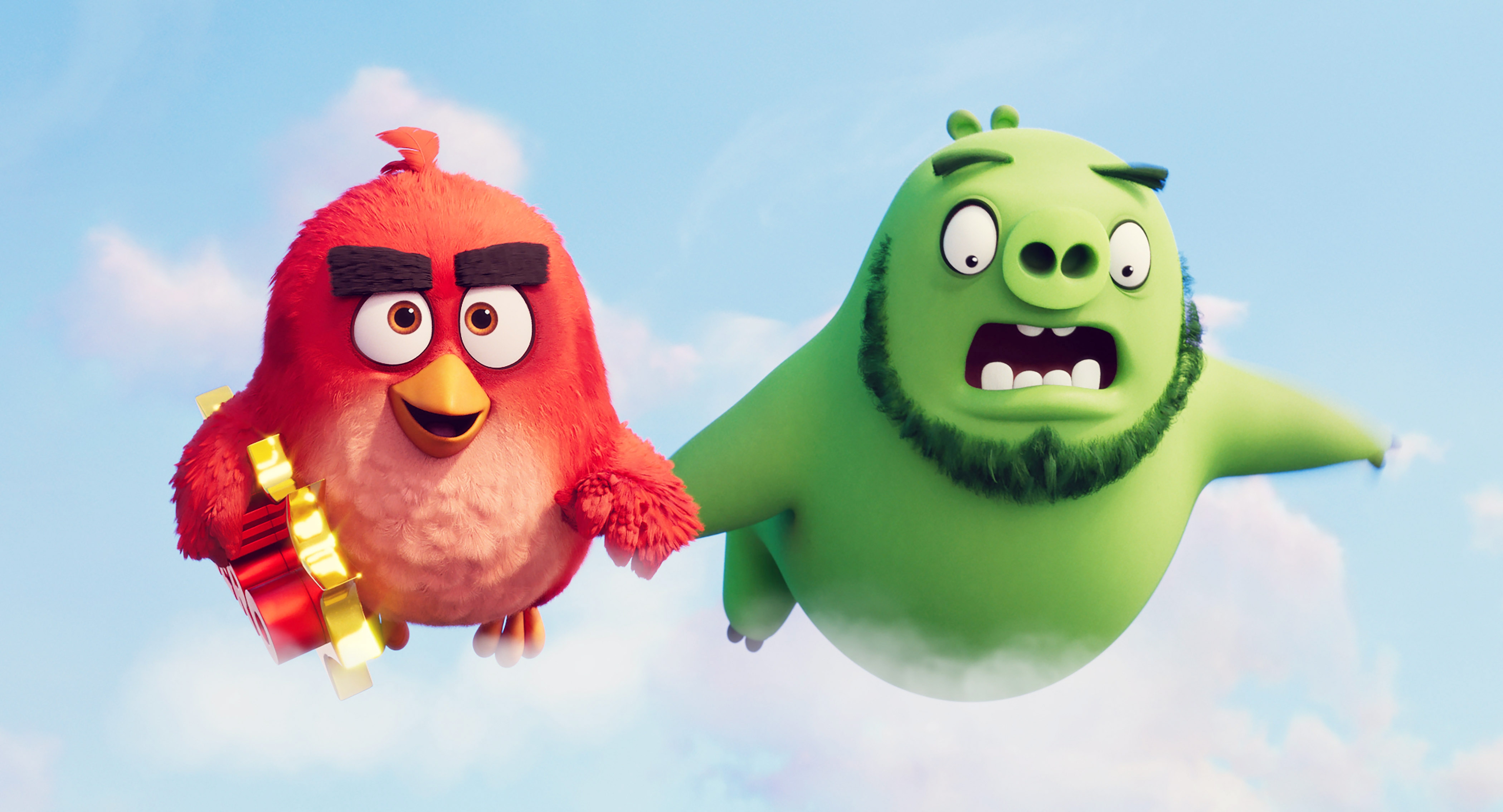 Animated characters, a red bird with a determined expression and a green pig looking surprised, are flying in a sky