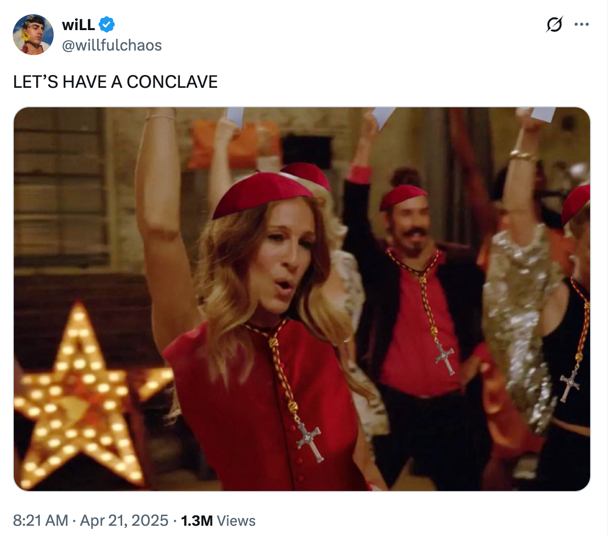 Person in festive costume with a red beret and cross necklace dances energetically in a lively room, with others in similar attire celebrating