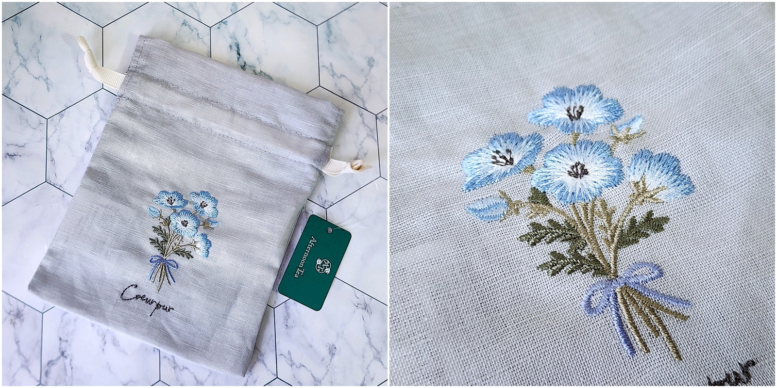 刺繍された花束のデザインが施された布製ポーチ。隣に緑色のタグがある。