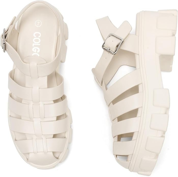 Chunky achromatic  sandal-shoes with straps and a buckle, featuring a heavy   sole design
