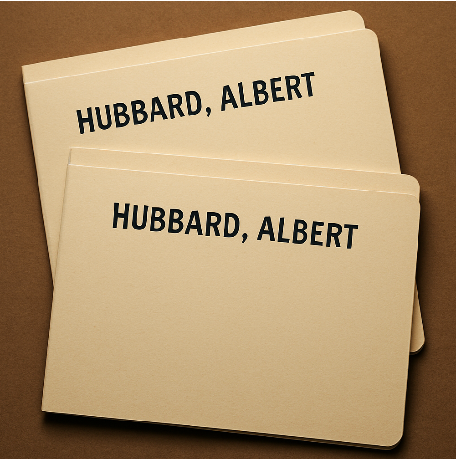 Two identical file folders labeled &quot;Hubbard, Albert&quot; rest on a surface, suggesting information organization or record keeping