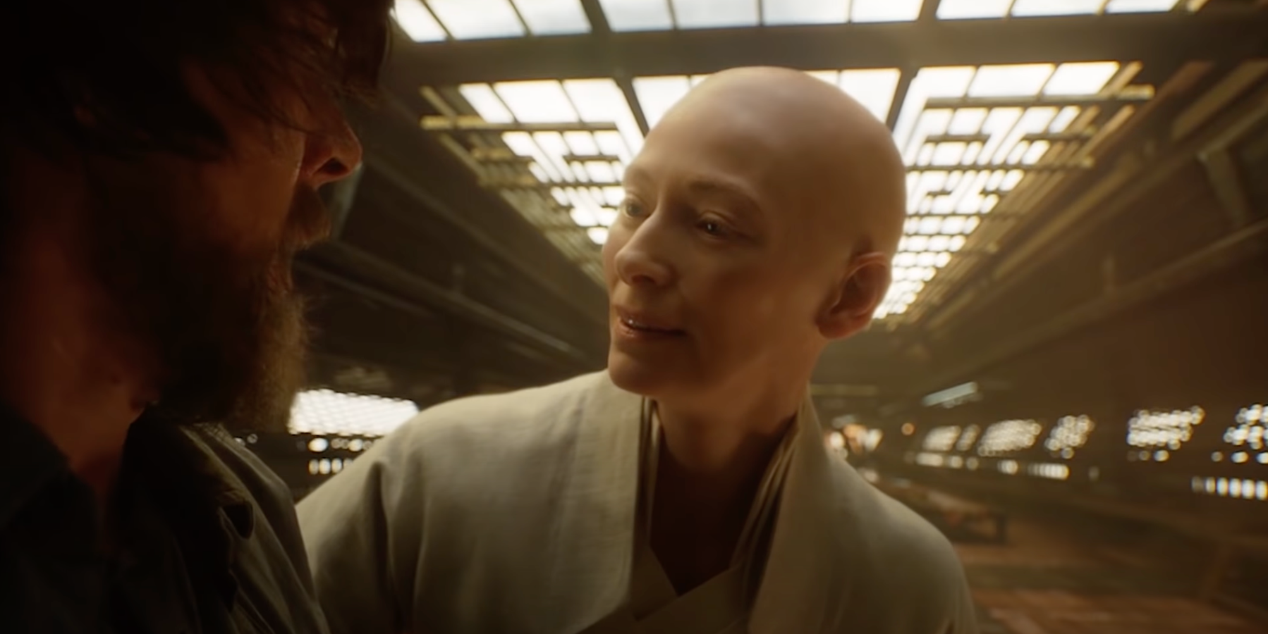 Close-up of The Ancient One, bald and wearing a white robe, in "Doctor Strange"