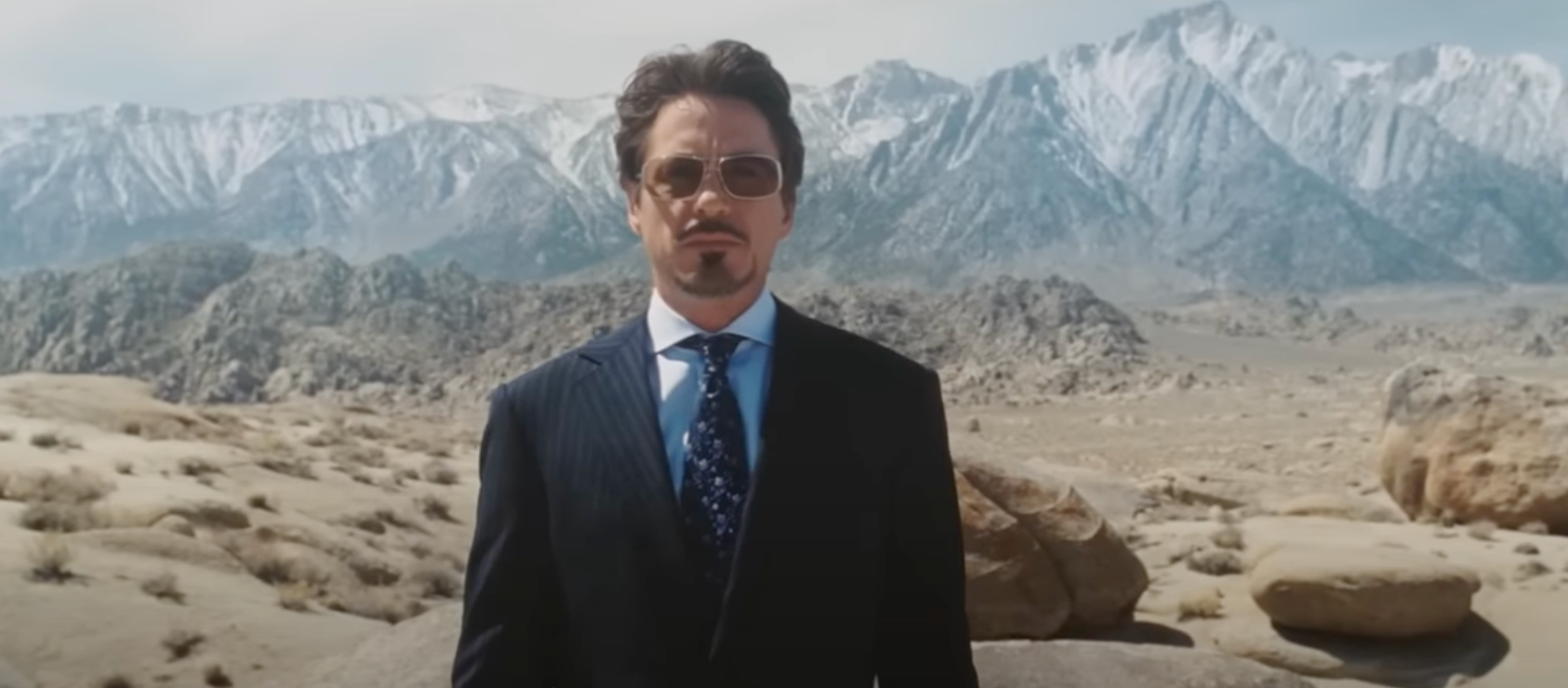 Tony Stark against a desert landscape in "Iron Man"
